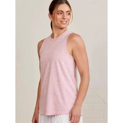 Side view of the Tasc Women's Nola Tank 2.0 in Heritage Blue on a model against a light background.