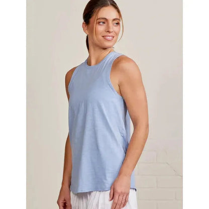 Side view of the Tasc Women's Nola Tank 2.0 in Heritage Blue showing the sleeveless design on a model against a light background.