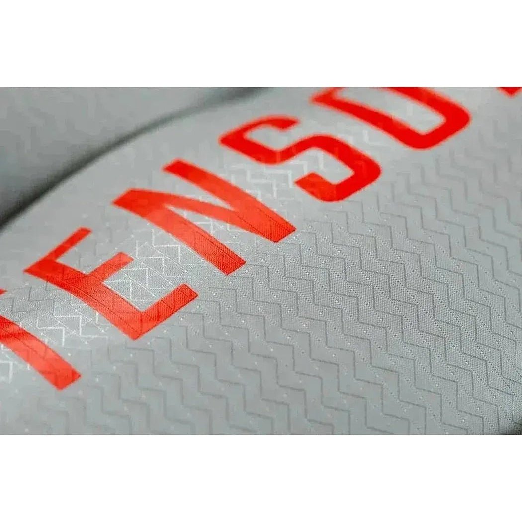 A close-up of the Tensor All-Season Ultralight Insulated Sleeping Pad in Regular Wide showing the red text and textured surface.