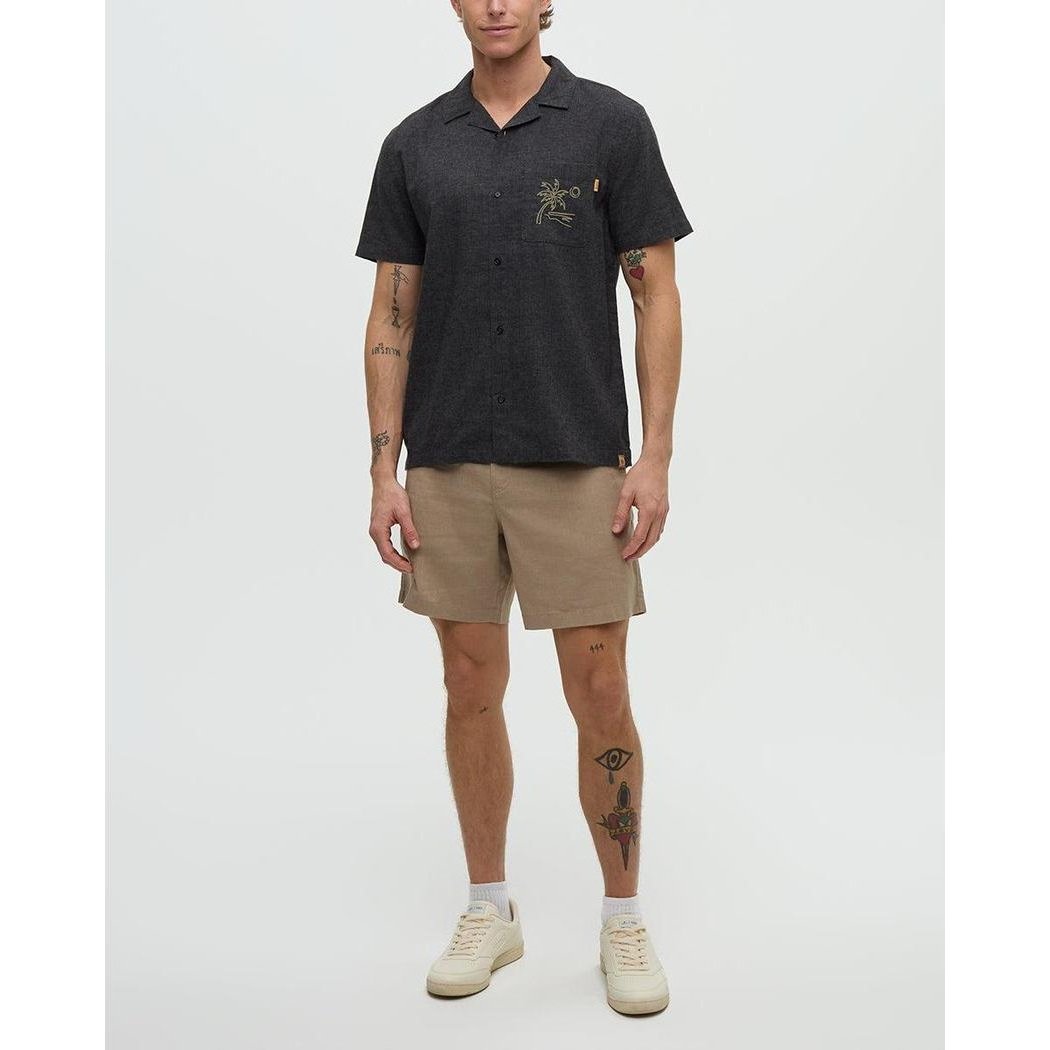 A model wearing the Tentree Men's Chambers Pocket Shirt in Meteorite Black/Khaki stands against a plain white background.