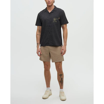 A model wearing the Tentree Men's Chambers Pocket Shirt in Meteorite Black/Khaki stands against a plain white background.