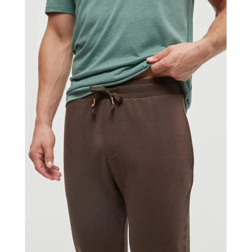 A front view of the Tentree Men's TreeFleece Atlas Sweatpant in Kona, showing the drawstring waist and a model wearing it against a plain background.