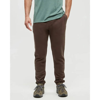 A front view of the Tentree Men's TreeFleece Atlas Sweatpant in Kona, showing the model wearing them with a plain white background.