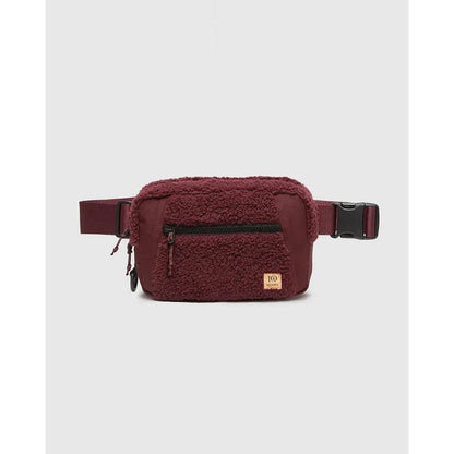 A front view of the Tentree Valdes Hip Pack in BurCarameWarOak with a zippered pocket and adjustable strap against a plain white background.