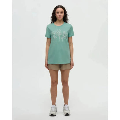 A model wearing the Tentree Women's Cummer Flora T-Shirt in Turquoise Sky Vintage White stands against a white background.