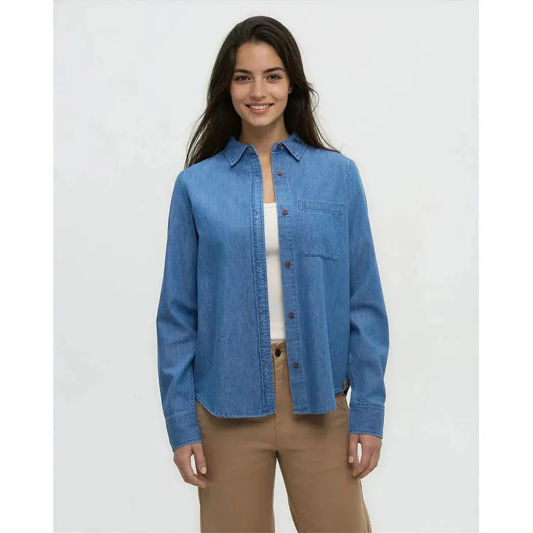 A model wears the Tentree Women's Denim Sloan Shirt in Mid Wash against a plain white background.