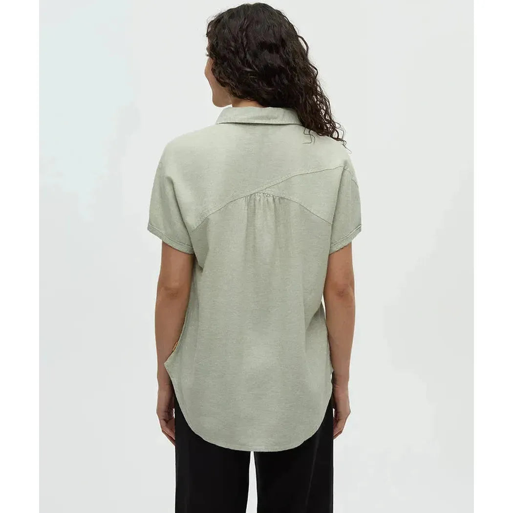 Back view of the Tentree Women's Magnolia Shirt in Light Moss on a model against a white background.