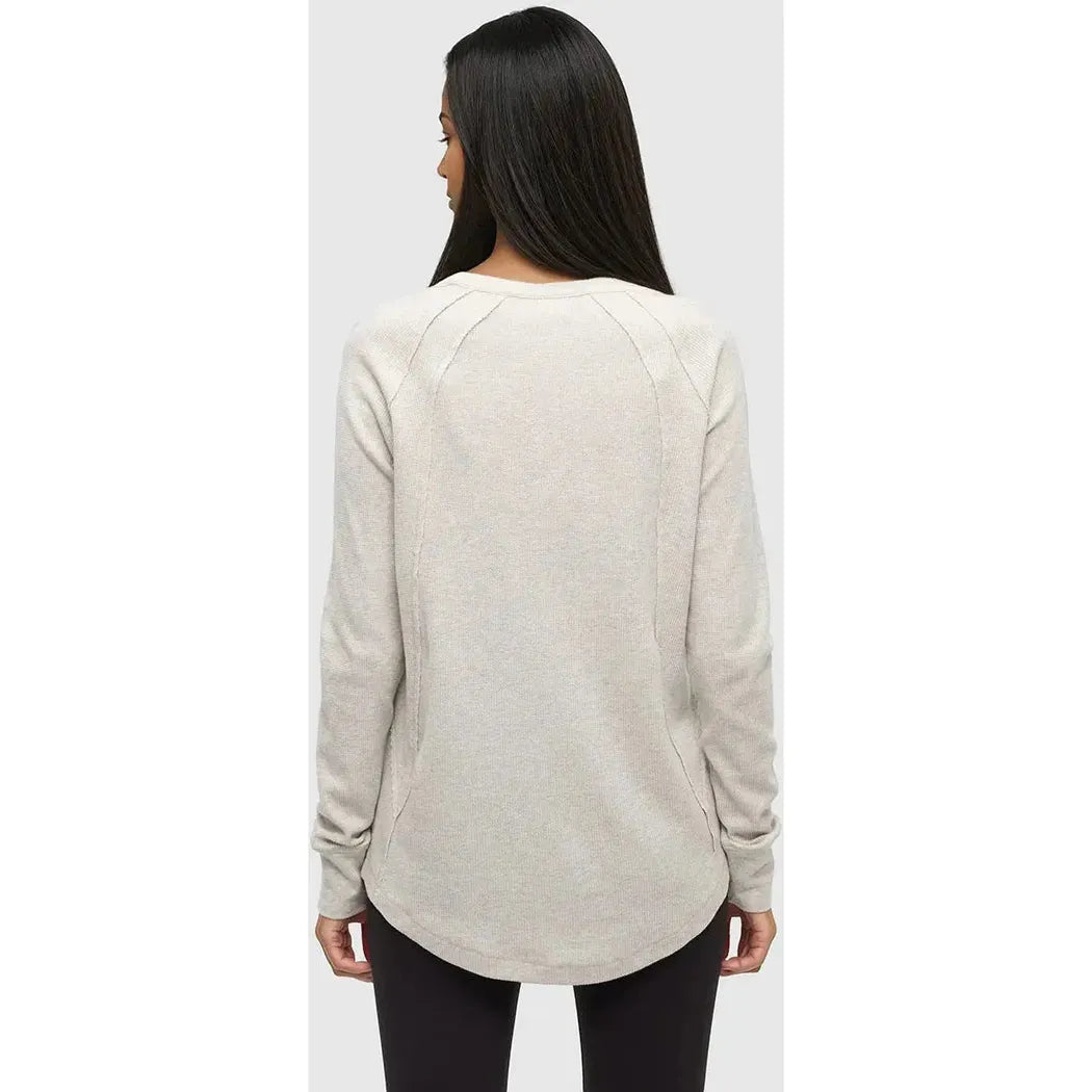 Back view of the Tentree Women's Storey Longsleeve in Vintage White Heather on a model against a light gray background.