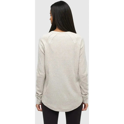 Back view of the Tentree Women's Storey Longsleeve in Vintage White Heather on a model against a light gray background.
