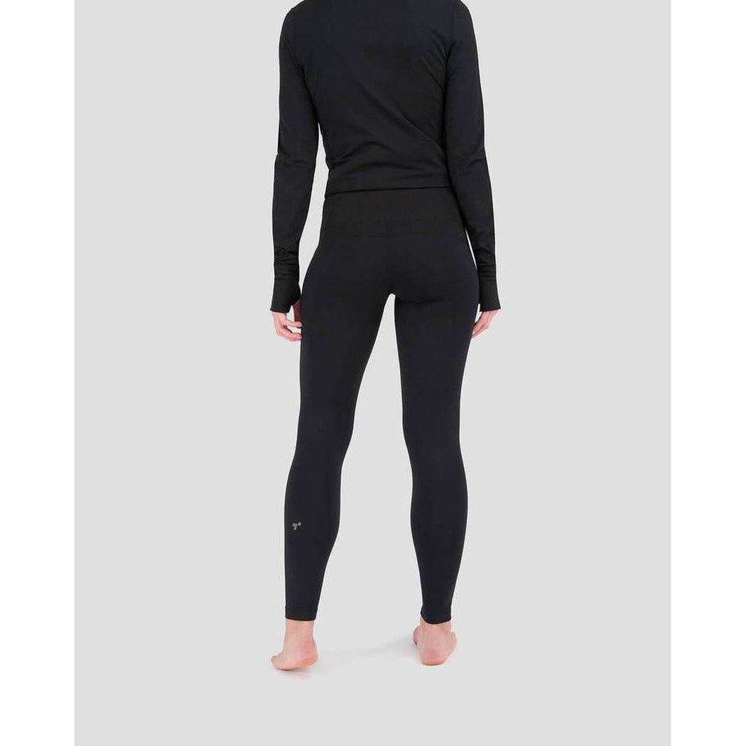 Back view of the Terramar 2.0 Women's Cloud Nine Performance Tights in Black on a barefoot model against a light gray background.