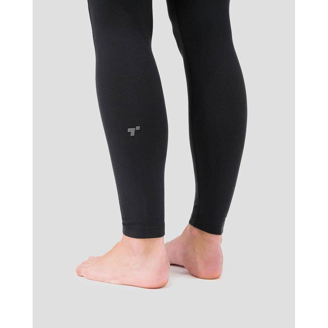 Side view of the Terramar 2.0 Women's Cloud Nine Performance Tights in Black showing the logo on the calf against a light gray background.