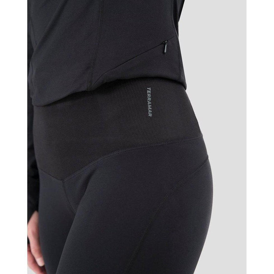 Side view of the Terramar 2.0 Women's Cloud Nine Performance Tights in Black showing the waistband and zipper detail against a light background.