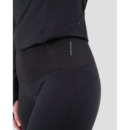 Side view of the Terramar 2.0 Women's Cloud Nine Performance Tights in Black showing the waistband and zipper detail against a light background.