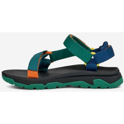 Side view of the Teva Kid's Hurricane XLT JR in Blue Coral Multi showing the adjustable straps and rugged outsole against a white background.