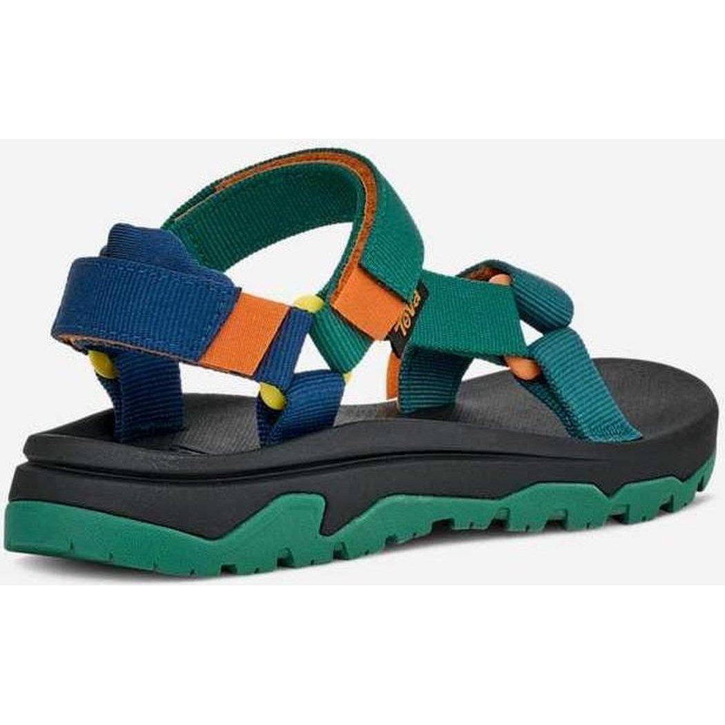 Side view of the Teva Kid's Hurricane XLT JR in Blue Coral Multi showing the thick lugged outsole against a white background.