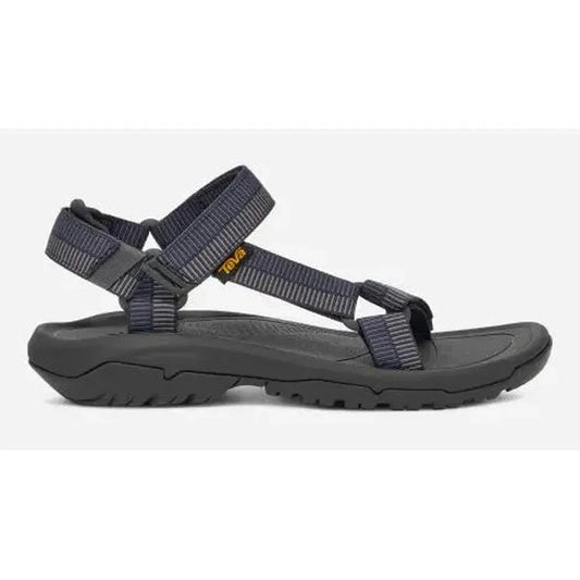 Side view of the Teva Men's Hurricane XLT2 Sandal in Archive Ladder Navy showing the adjustable straps and rugged outsole against a white background.