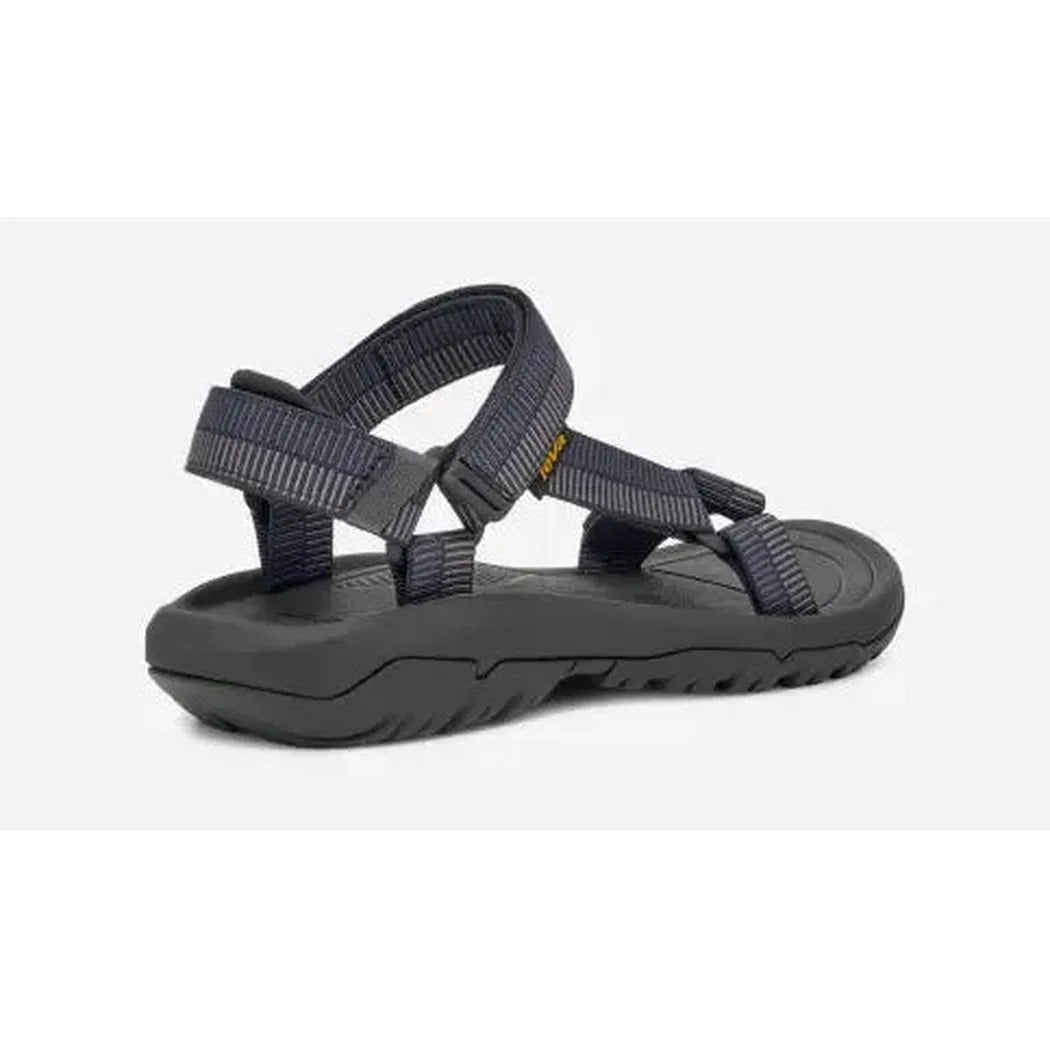 Side view of the Teva Men's Hurricane XLT2 Sandal in Archive Ladder Navy showing the adjustable straps and rugged outsole against a white background.