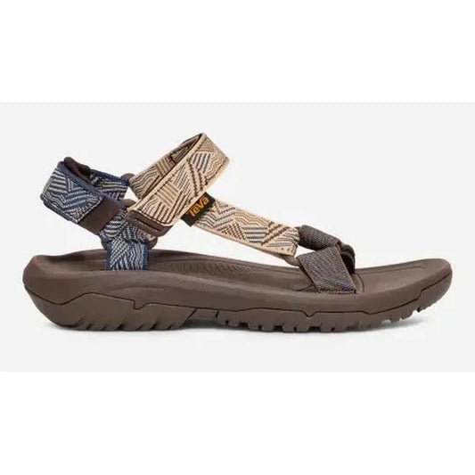 Side view of the Teva Men's Hurricane XLT2 Sandal in Archive Ladder Navy showing the lugged outsole against a white background.