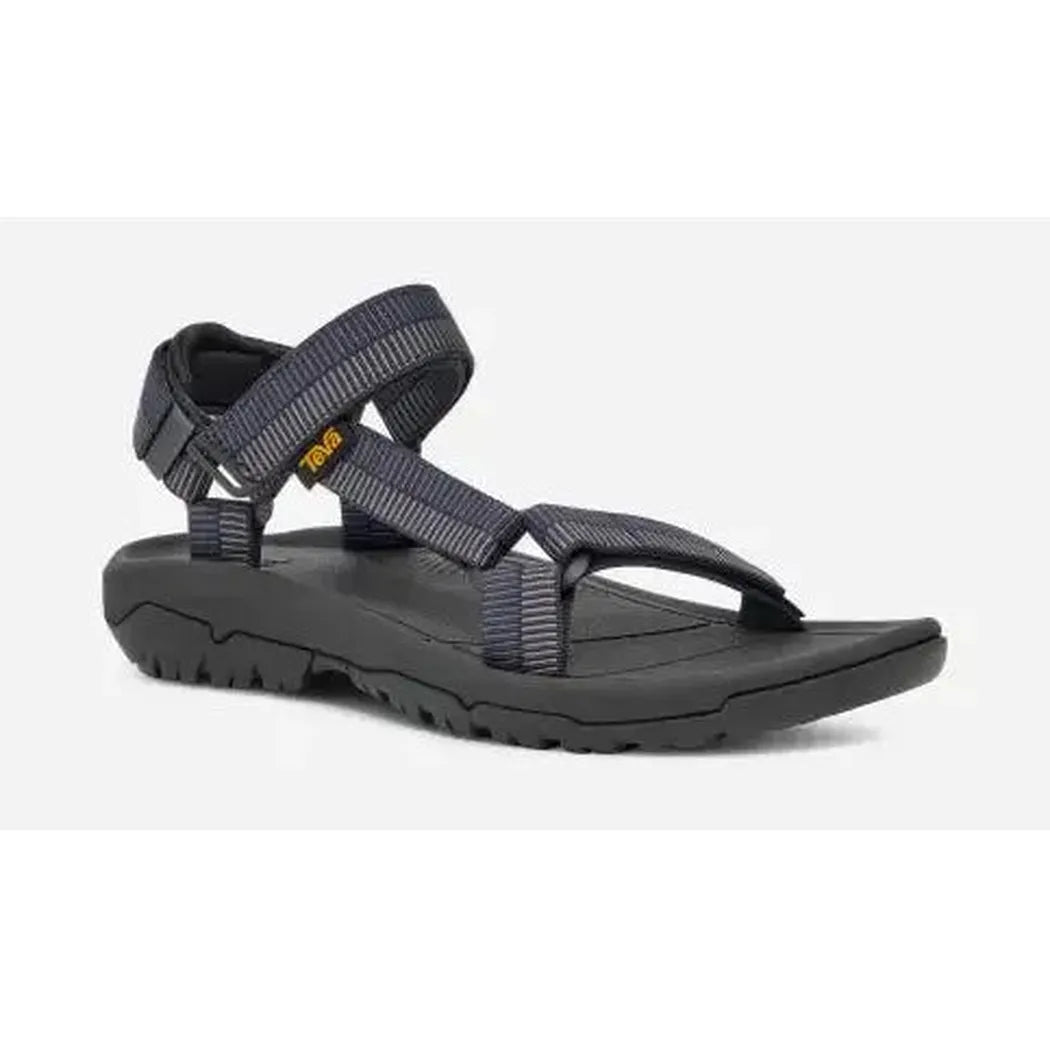 Side view of the Teva Men's Hurricane XLT2 Sandal in Archive Ladder Navy with a black outsole and adjustable straps against a white background.