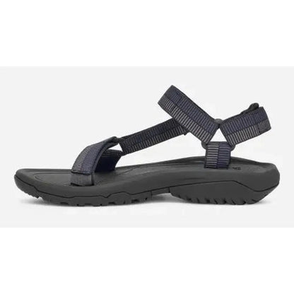 Side view of the Teva Men's Hurricane XLT2 Sandal in Archive Ladder Navy showing the adjustable straps and rugged outsole against a white background.