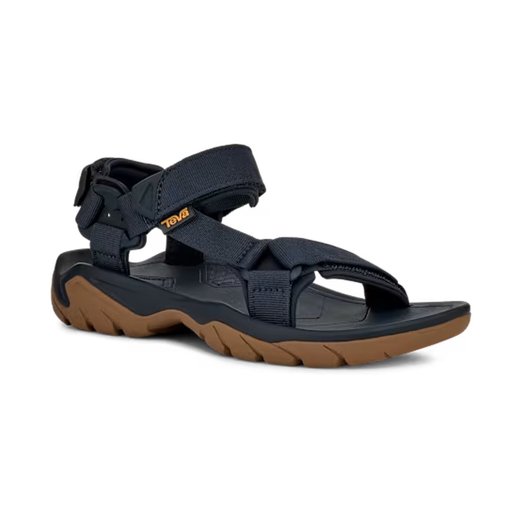 Side view of the Teva Men's Terra FI 5 Universal in Total Eclipse showing the adjustable straps and brown outsole against a white background.