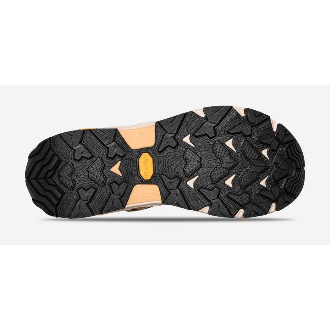The sole of the Teva Women's Grandview Max GTX boot shows its lugged tread pattern and Honey Brown/ Birch color against a white background.