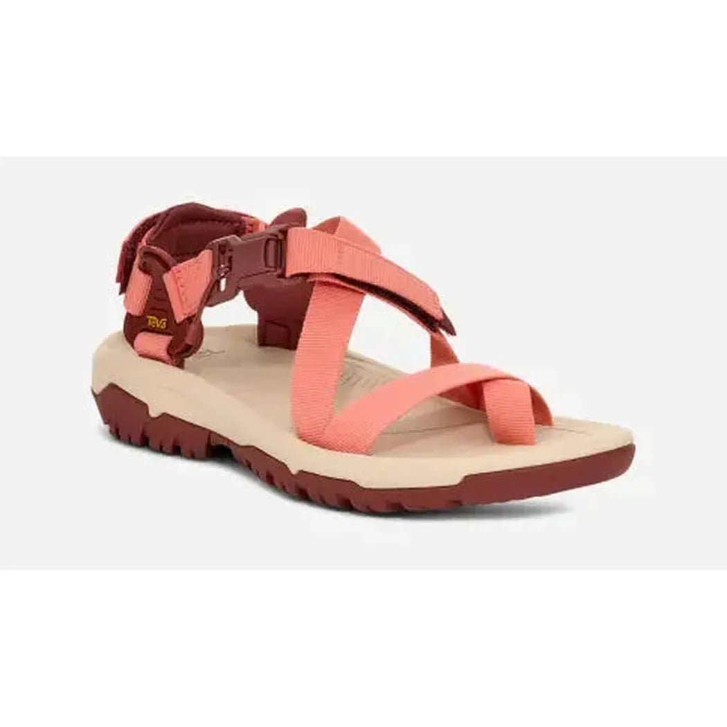 Side view of the Teva Women's Hurricane Terra Dactyl Hiking Sandal in Mahogany showing the adjustable strap and rugged outsole against a white background.