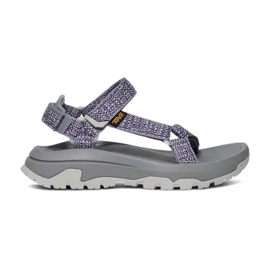 Side view of the Teva Women's Hurricane XLT3 in Criss Cross Bossa Nova showing the adjustable straps and thick outsole against a white background.