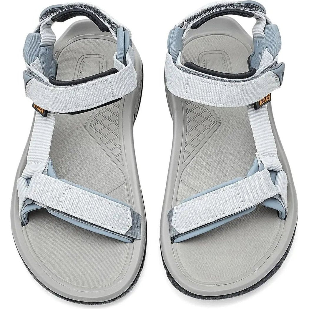 Top view of the Teva Women's Terra FI 5 Universal sandals in Dawn Blue/Tradewinds, showing the adjustable straps and textured outsole against a white background.