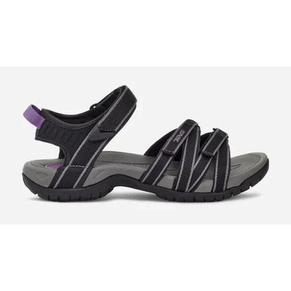 Side view of the Teva Women's Tirra in Black/Grey showing the adjustable straps and white background.