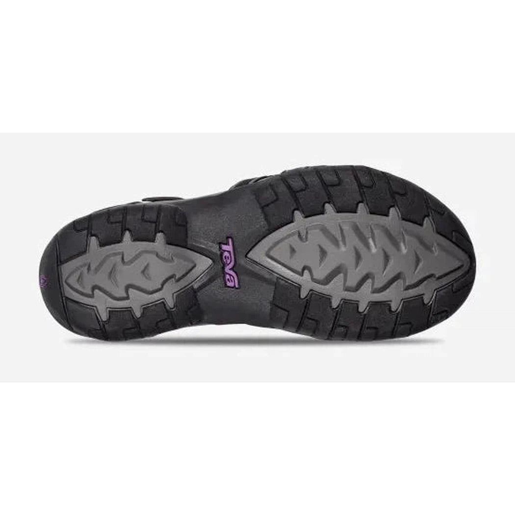The sole of the Teva Women's Tirra in Black/Grey is shown from below, with a white background.