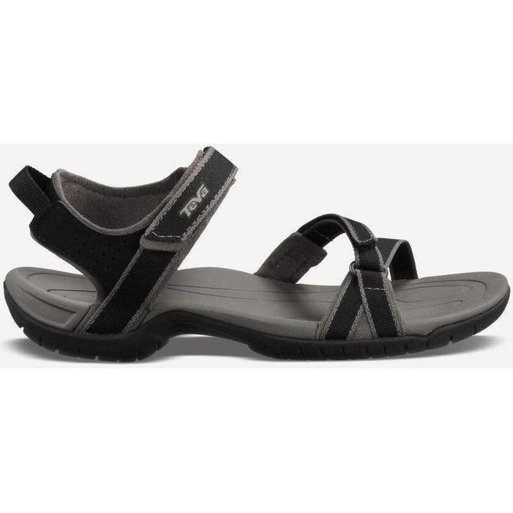 Side view of the Teva Women's Verra in Black showing the adjustable straps and gray sole against a white background.