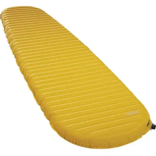 Side view of the Therm-a-Rest NeoAir Xlite NXT yellow sleeping pad showing its ribbed texture and inflation valve against a white background.