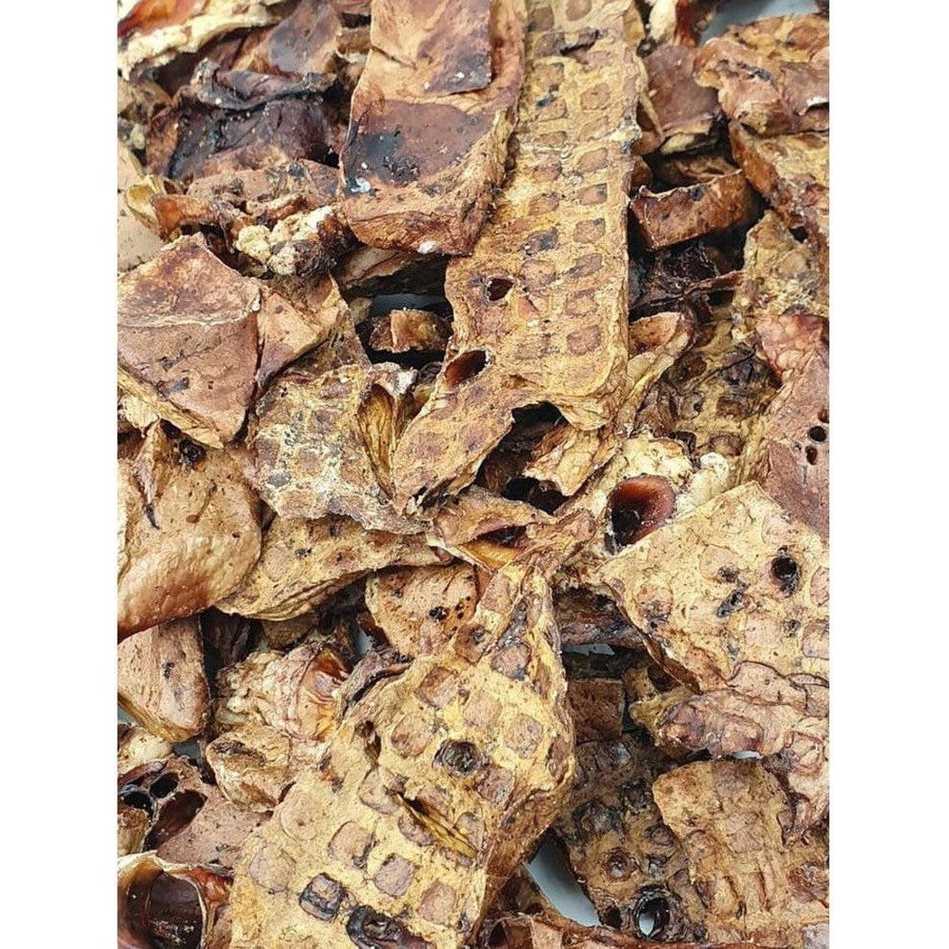 Close-up of Tickled Pet All Natural Lamb Lung treats showing their textured, brown appearance.
