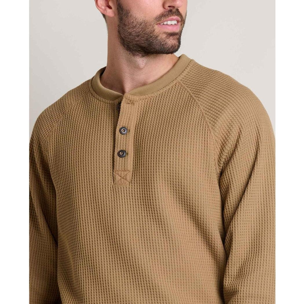 A front view of the Toad & Co Men's BitterRoot Long Sleeve Henley in Honey Brown on a model against a plain background.