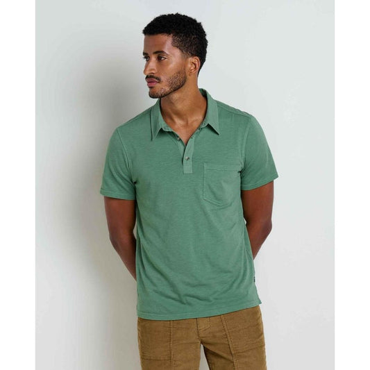 A side view of the Toad & Co Men's Primo Short Sleeve Polo in Ivy, showing the pocket and collar, against a plain white background.