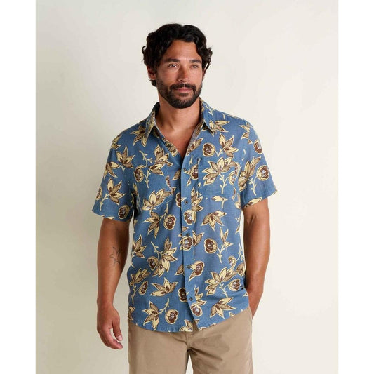 A model wears the Toad & Co Men's Salton Short Sleeve Shirt in Pacific Blue Print against a plain background.