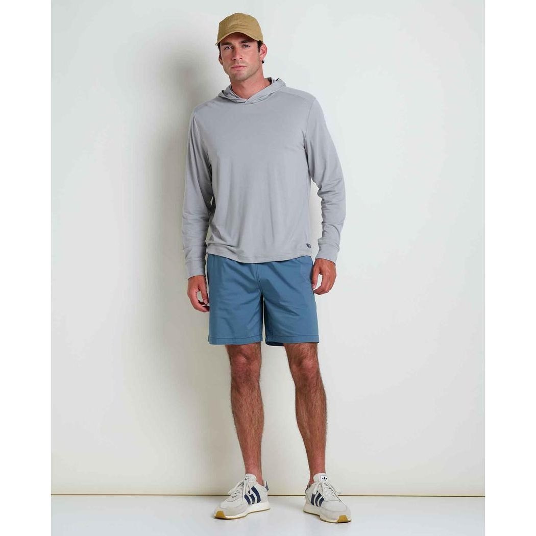 A model wearing the Toad & Co Men's Swifty Long Hoodie in Light Ash stands against a plain white background.