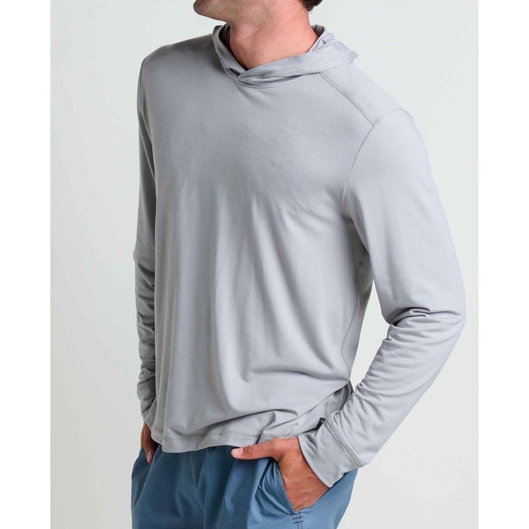 Side view of the Toad & Co Men's Swifty Long Hoodie in Light Ash showing the hood and model wearing it against a plain background.