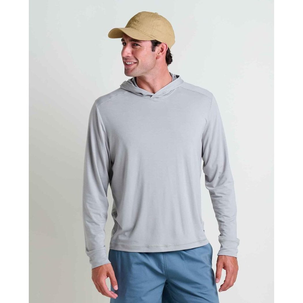 A man wearing the Toad & Co Men's Swifty Long Hoodie in Light Ash stands against a plain white background.