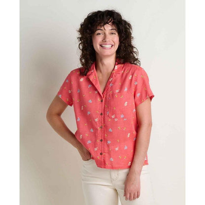 A woman wearing the Toad & Co Women's Camp Cove Shirt in Crabapple stands against a plain white background.