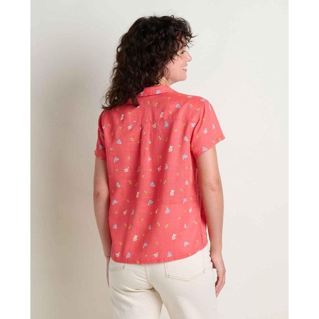 Back view of the Toad & Co Women's Camp Cove Shirt in Crabapple on a model wearing white pants against a plain background.