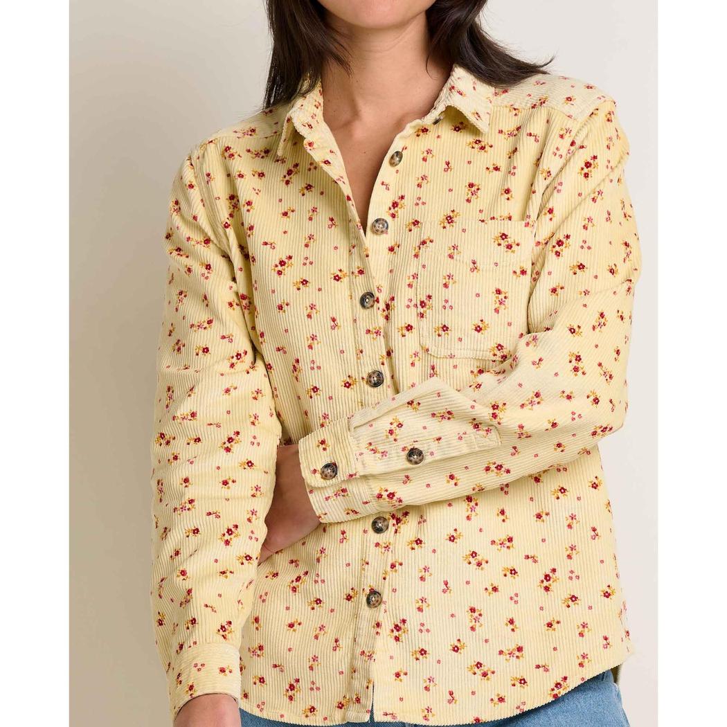 A front view of the Toad & Co Women's Cascadia Long Shirt in Barley Floral Print worn by a model against a neutral background.