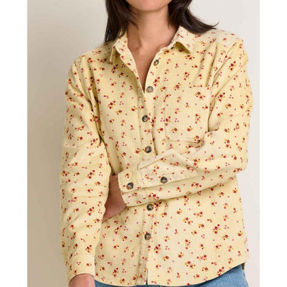 A front view of the Toad & Co Women's Cascadia Long Shirt in Barley Floral Print worn by a model against a neutral background.