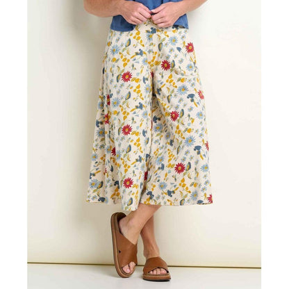 A model wearing Toad & Co Women's Chaka Culotte in Almond Print stands against a white background with brown sandals.