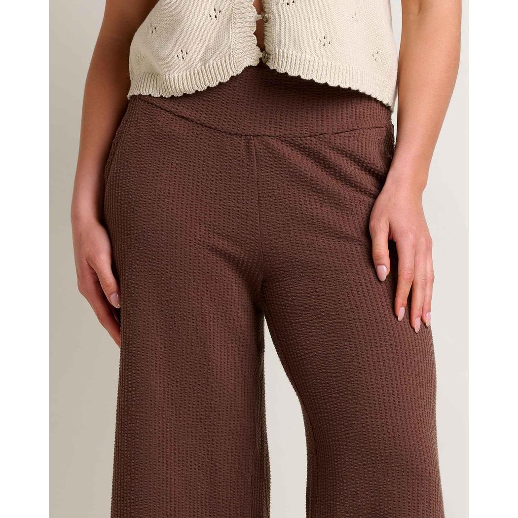 A front view of the Toad & Co Women's Chaka Wide Leg Pant in ChestnutTexture on a model wearing a cream top against a light background.