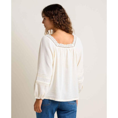 Back view of the Toad & Co Women's Manzana Peasant LS Shirt in Egret showing the lace trim on the collar and cuffs against a plain background.