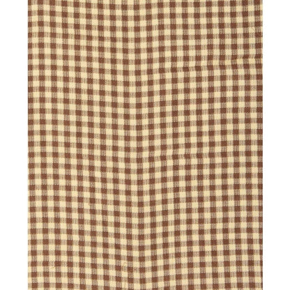 A close-up of the Toad & Co Women's Manzana Quilted Jacket in Partridge Gingham showing the gingham pattern.
