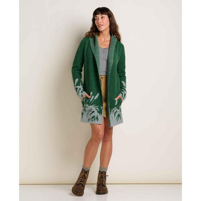 A model wearing the Toad & Co Women's Merino Heartfelt Hoodie in Coyote Ombre stands against a plain white background.