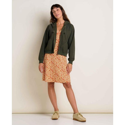 A model wears the Toad & Co Women's Rosalinda Dress in GourdIkatPrint with a Charcoal/Graphite jacket and beige shoes against a plain background.